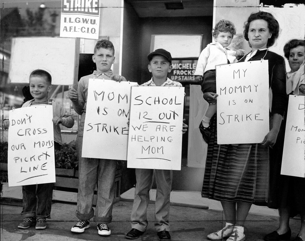 A family striking against unfair labor practices.